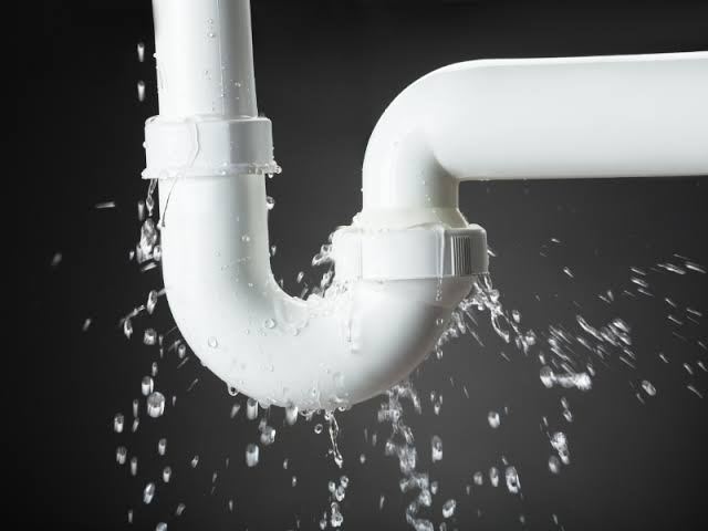 plumber under sink pipes