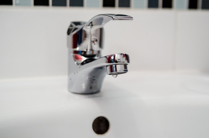 plumber under sink pipes