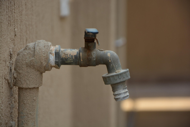 plumber under sink pipes