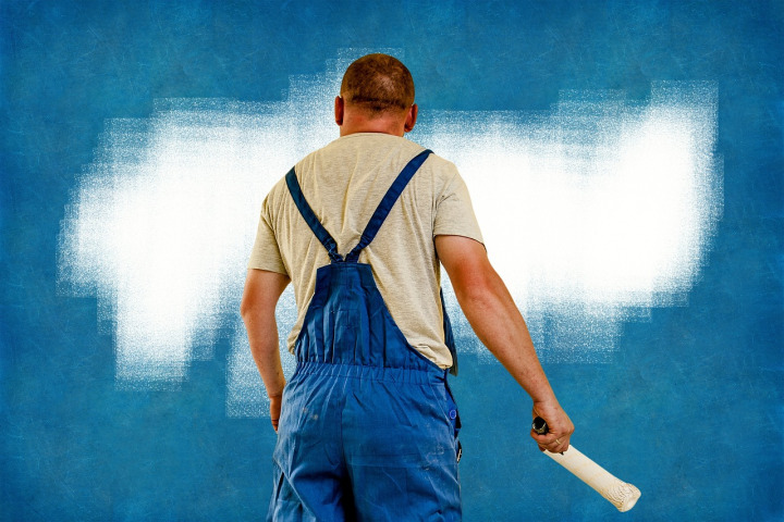 painter painting wall roller